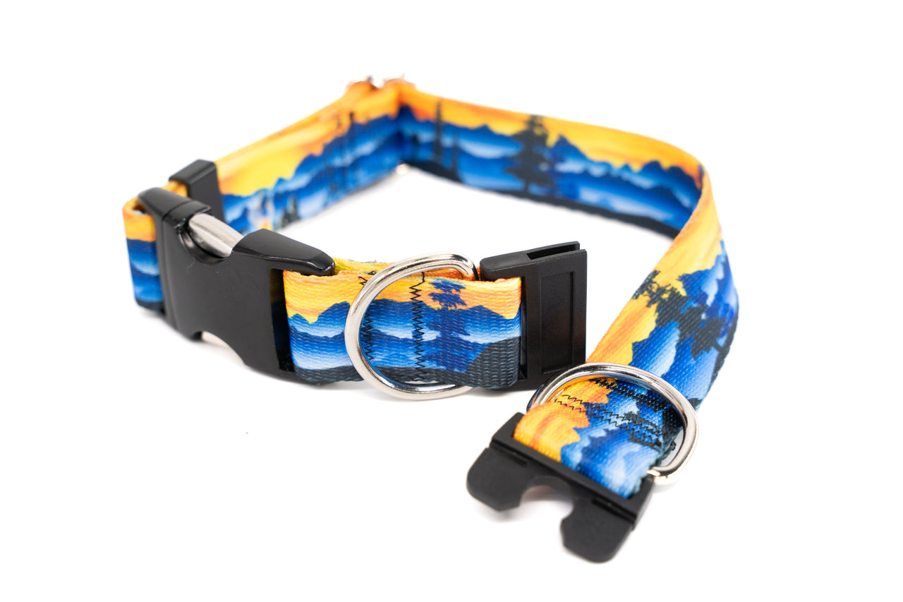 Dog collar with blue and yellow mountain design on a white background